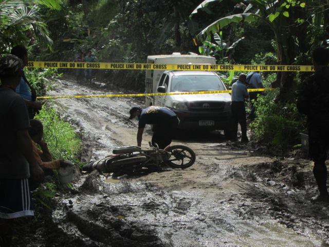 VILLAGE CHIEF, AIDE; SHOT TO DEATH