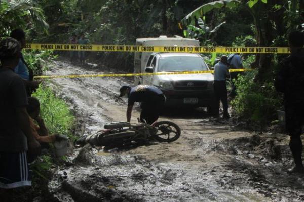 Village Chief, Aide; Shot to Death